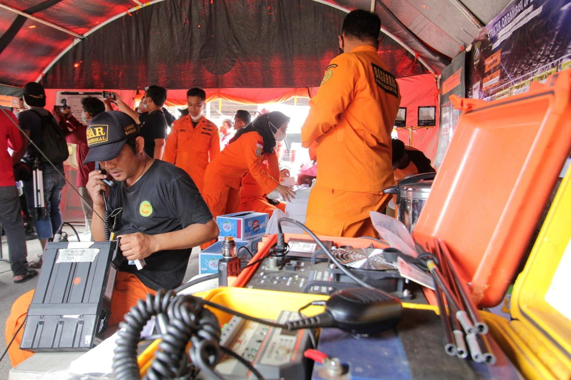 Indonesian search and rescue personnel prepare for search and rescue for victims of a ship collision at a port in Indramayu, West Java province in Indonesia April 4, 2021. (Antara Foto/Dedhez Anggara via Reuters)