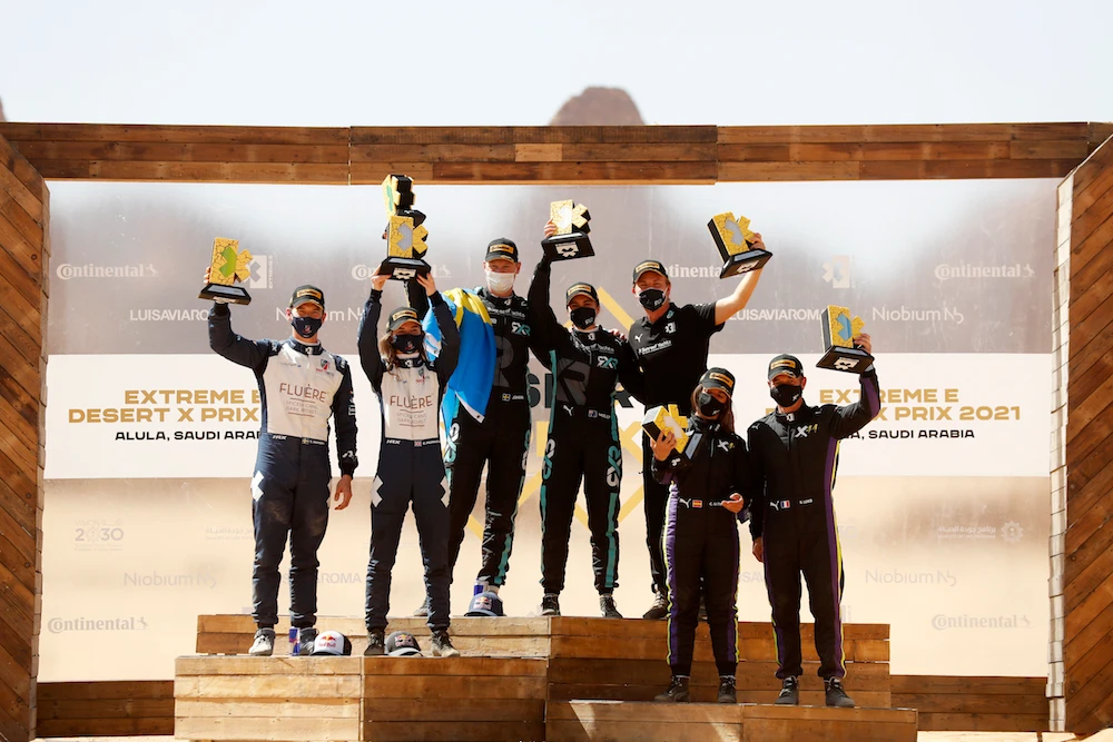 Roseberg X Racing, Andretti United and X44 celebrate their 1-2-3 podium finish in the first ever Desert X Prix. (Supplied/Extreme E)