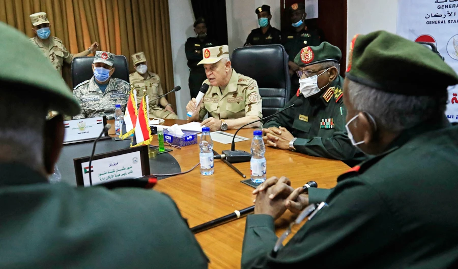Egyptian military Chief of Staff Mohamed Farid (C-L) speaks alongside his Sudanese counterpart Mohamed Othman al-Hussein during a meeting of the Egyptian-Sudanese military committee in Sudan's capital Khartoum on March 2, 2021. (AFP)