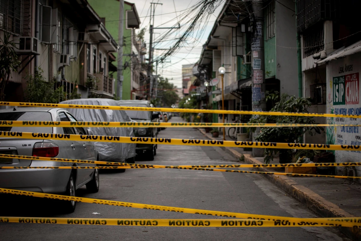 A makeshift barrier set up on a street of an area under lockdown in Manila. (Reuters)