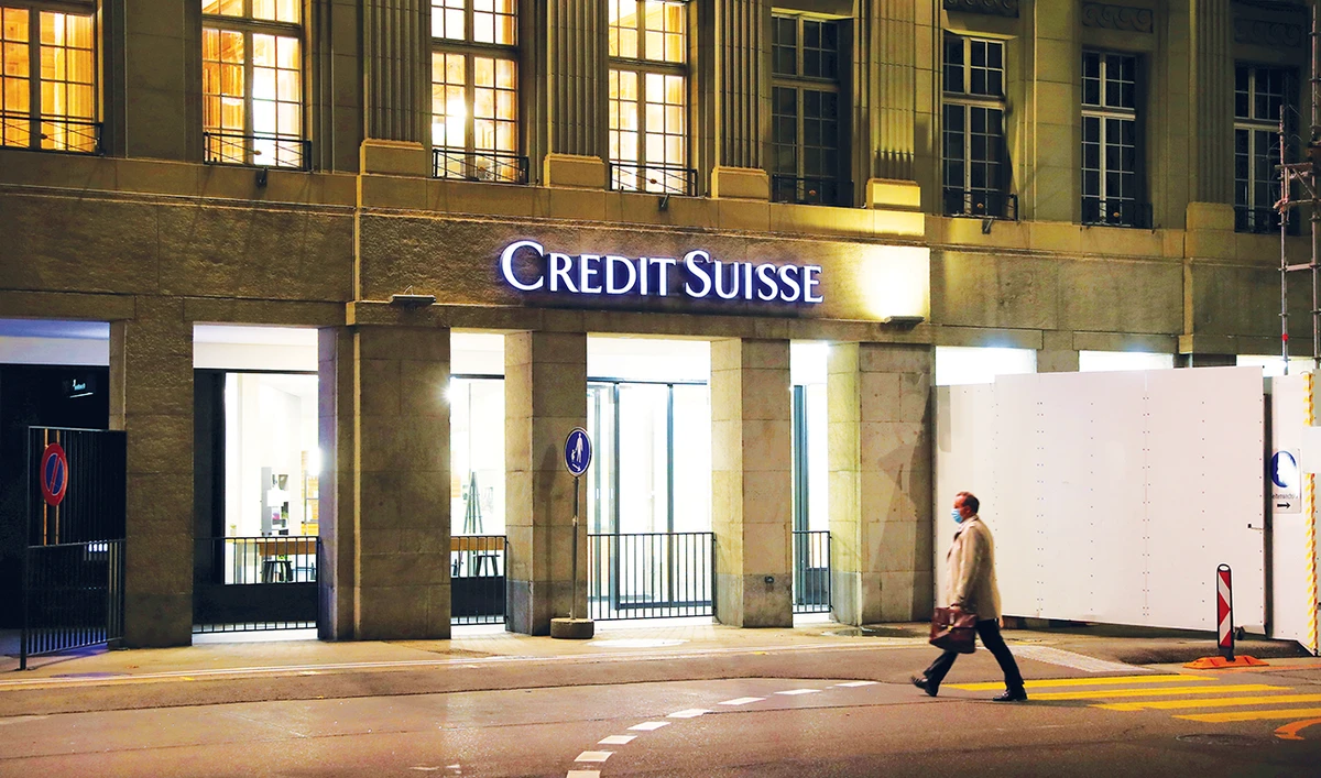 Swiss investment bank Credit Suisse said it has suspended a share buyback program and reduced its dividend in the wake of the default. (Reuters/File)