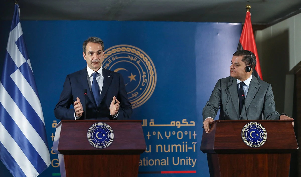 Libya's interim prime minister Abdul Hamid Dbeibah (R) and Greece's Prime Minister Kyriakos Mitsotakis (L) hold a joint press conference in Libya's capital Tripoli on April 6, 2021. (AFP)