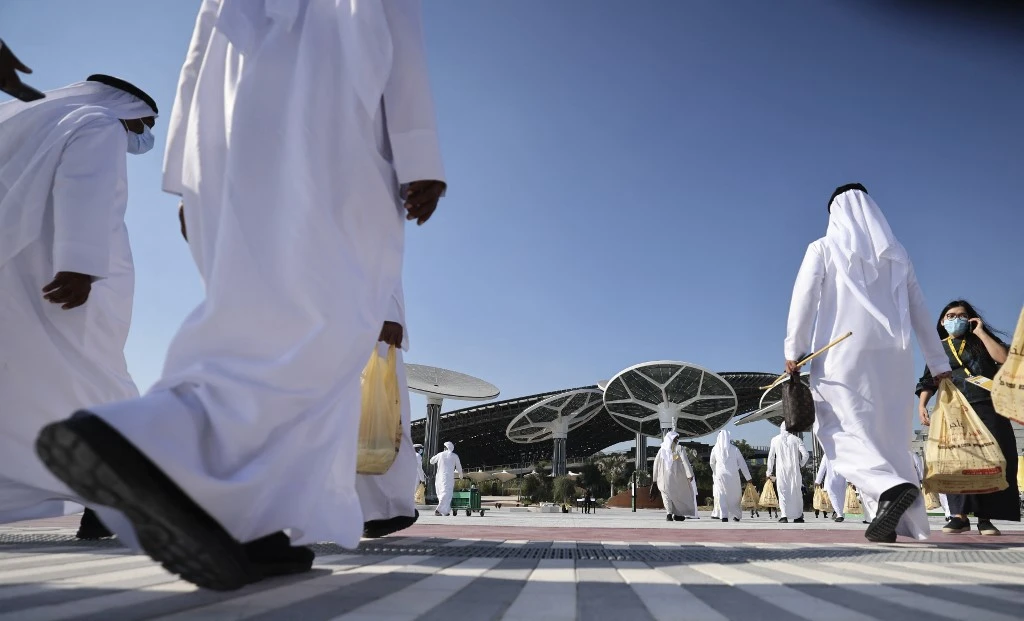 People walk towards the Sustainability Pavilion, a week ahead of its public opening, at the Dubai Expo 2020 in Dubai on Jan. 16, 2021. (File/AFP)