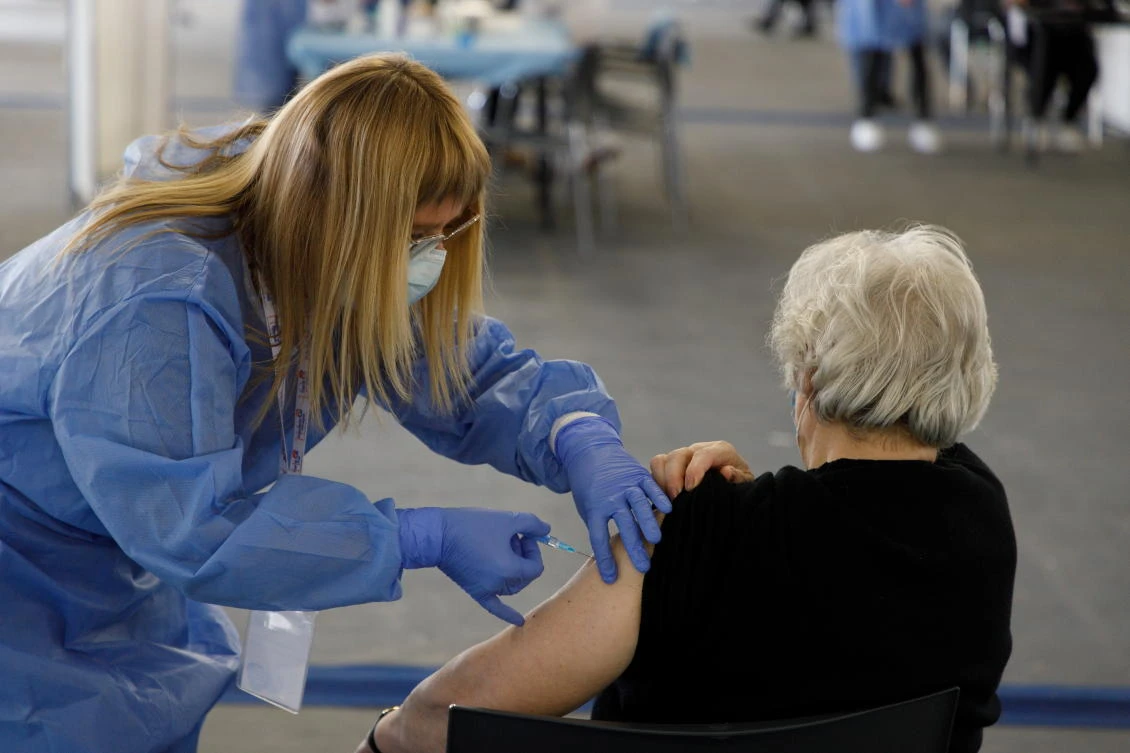 A woman receives an injection with a dose of AstraZeneca COVID-19 vaccine, at a centre in Zagreb Fair hall, amid the outbreak of coronavirus disease (COVID-19), Croatia, April 7, 2021. (Reuters)