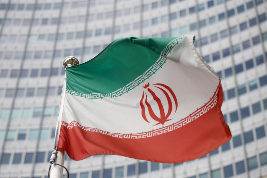 The Iranian flag waves in front of the International Atomic Energy Agency (IAEA) headquarters. (File/Reuters)