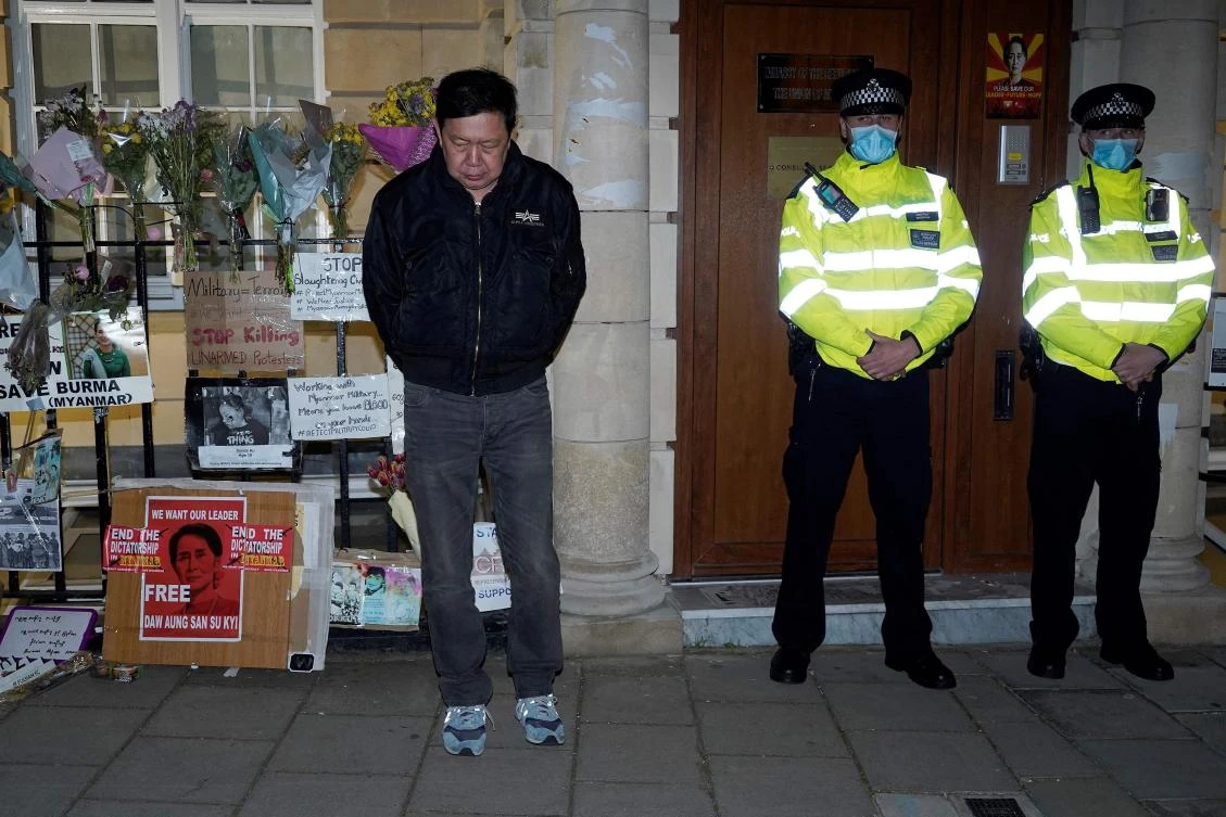 Kyaw Zwar Minn, Myanmar’s envoy to the United Kingdom, stands locked outside the Myanmar embassy in London on April 7, 2021. (AFP)