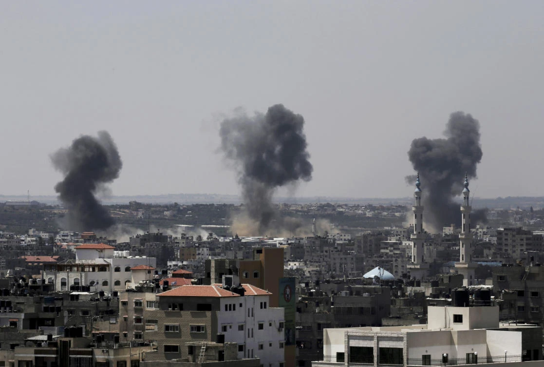 Smoke rises after Israeli missile strikes hit Gaza Strip in 2014, while Israel on Thursday said it’ll formally reject ICC’s decision to investigate potential war crimes against Palestinians. (AP)