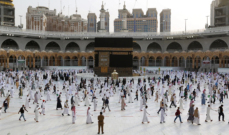 Muslim pilgrims circumambulate around the Kaaba, Islam's holiest shrine, at the centre of the Grand Mosque in the holy city of Makkah, while mask-clad and along specific pre-ordained rings as measures due to the COVID-19, on August 2, 2020. (AFP/File)