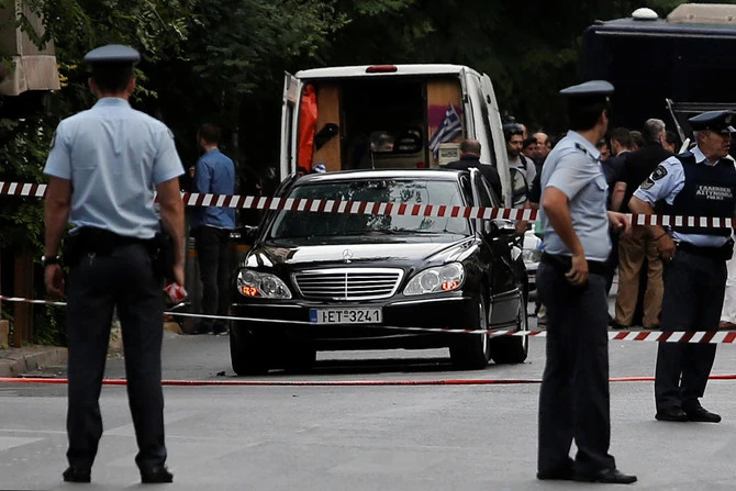 Greek Police around the car of former prime minister in previous incident in Greece that witnessed on Friday the gunning down of a veteran crime journalist. (Reuters File)