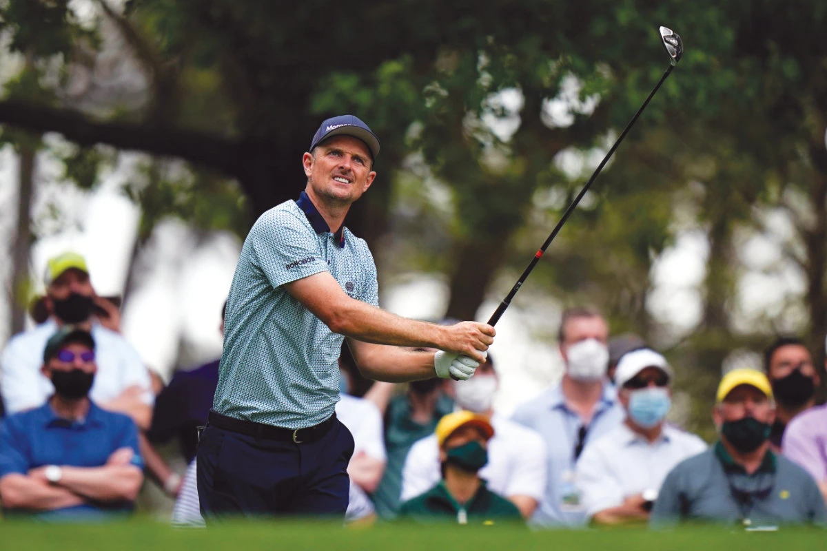 Justin Rose, of England, after hitting his tee shot on the fourth hole during the second round of the Masters golf tournament on Friday. (AP)