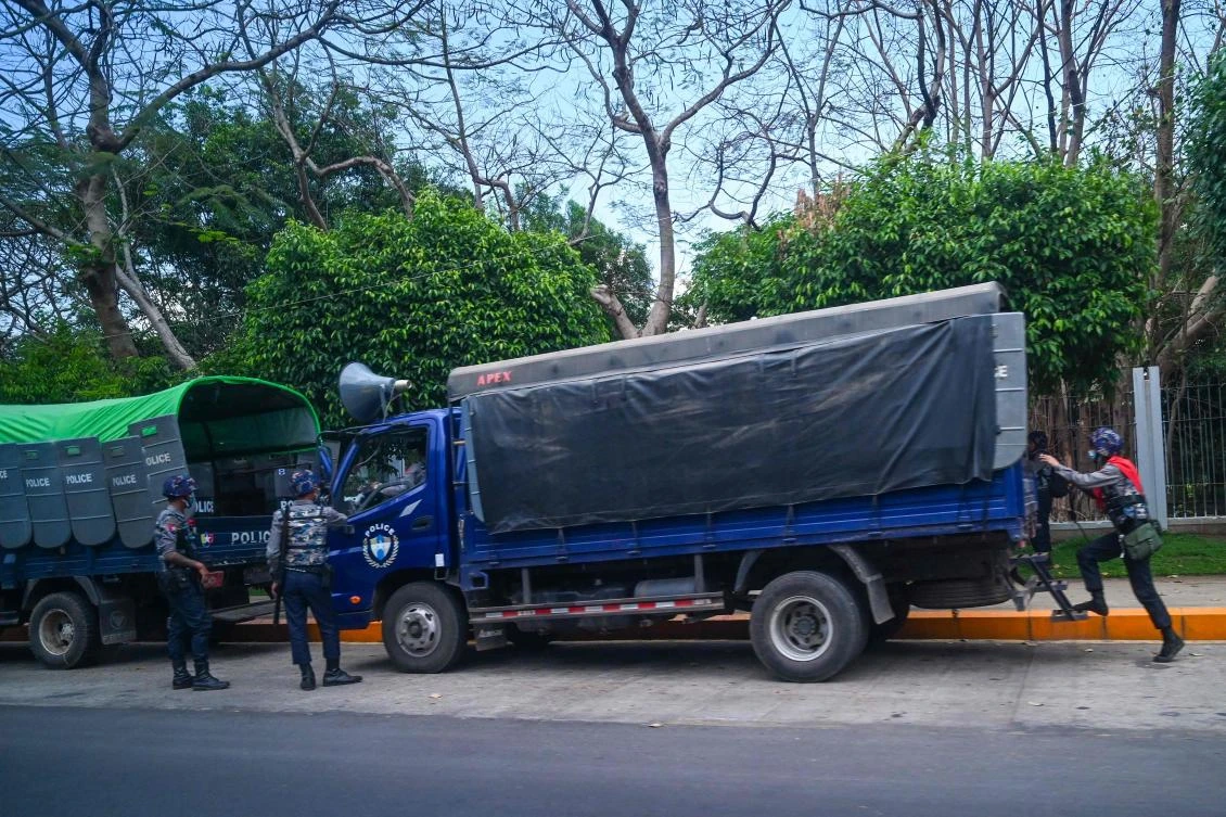 Police enter a vehicle near the premises of the Yangon Regional Parliament in Yangon. (AFP)