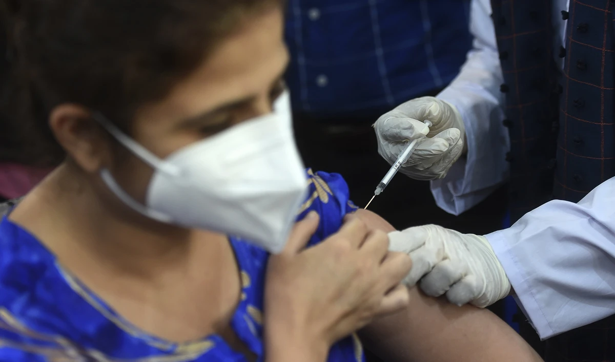 A health worker receives a dose of the Chinese-made Sinopharm Covid-19 vaccine, at a vaccination centre in Karachi on February 3, 2021. (AFP)