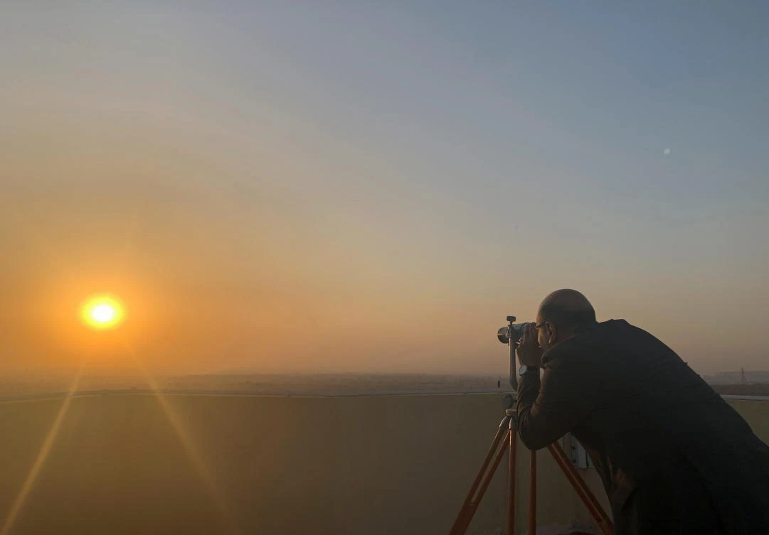 A man looks through a telescope as a historic Cairo observatory witnesses the changing of the moon to mark the beginning of the holy month of Ramadan in Cairo. (Reuters)