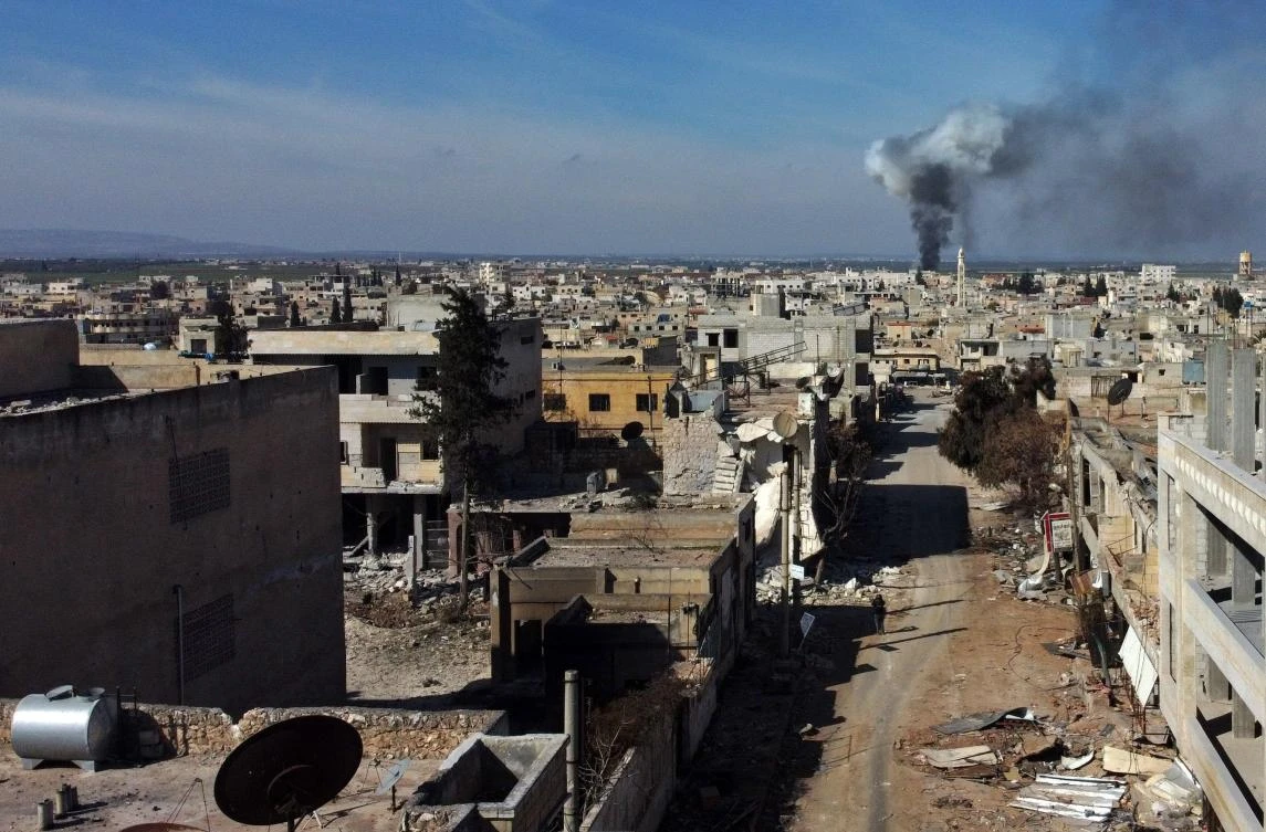 Smoke billows over the town of Saraqib in the eastern part of Idlib province, in northwestern Syria, following bombardment by Assad regime forces, Feb. 27, 2020. (AFP)
