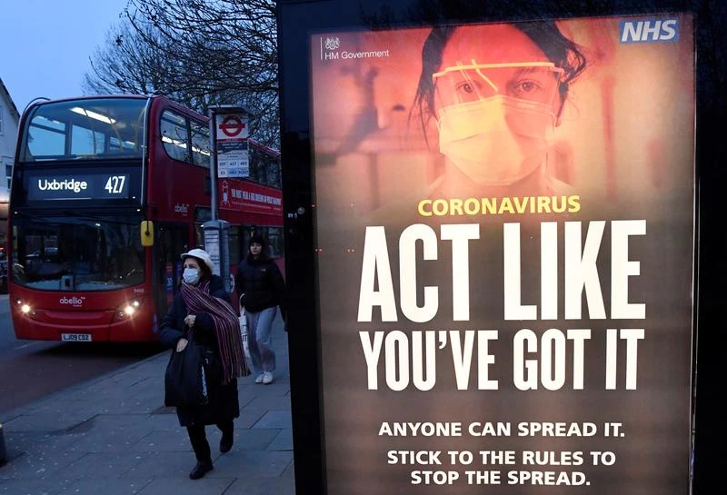 A public health information message at a bus stop in West Ealing, amid the spread of the coronavirus disease (COVID-19), London, Britain, February 1, 2021. (Reuters)