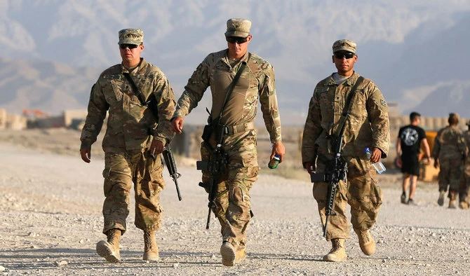 In this file photo, US troops walk at their base in Logar province, Afghanistan on Aug. 4, 2018. (REUTERS)