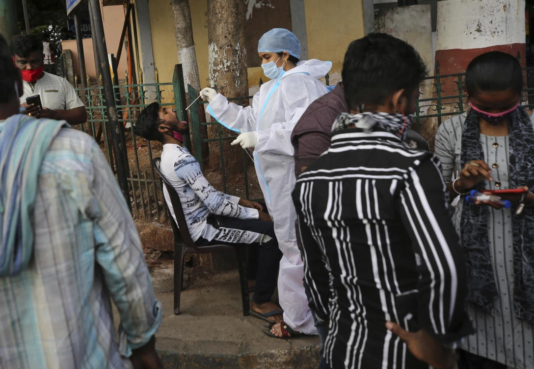 India is reporting a surge in coronavirus infections, which according to experts is due in part to growing disregard for social distancing and mask-wearing in public spaces. (AP)