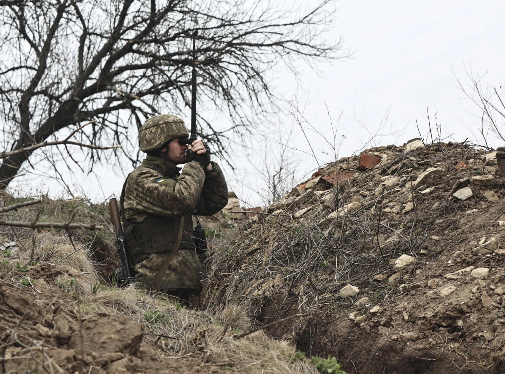A Ukrainian soldier is seen at fighting positions on the line of separation from pro-Russian rebels near Donetsk, Ukraine on April 12, 2021. (AP)