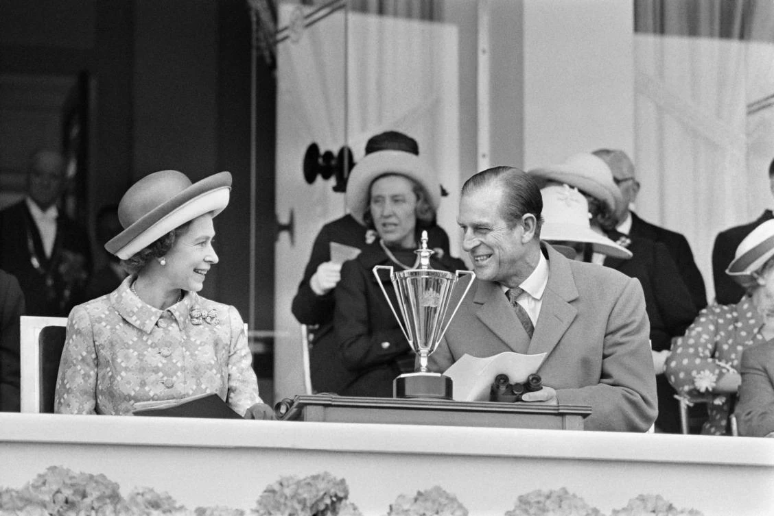 Queen Elizabeth II and her late husband Prince Philip Duke of Edinburgh at Longchamp Racecourse on the outskirts of Paris. (File/AFP)