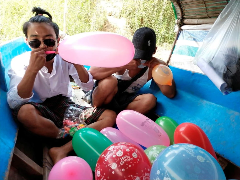 Residents inflate balloons to be used as form of protest against the military coup during the Thingyan festival in Hlaing River in Nyaungdon, Myanmar on April 16, 2021. (Reuters)