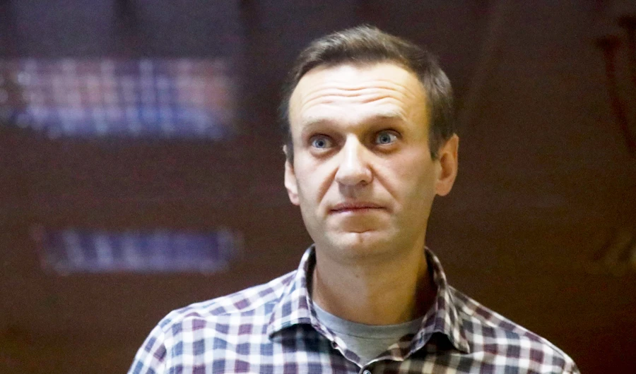 In this Saturday, Feb. 20, 2021 file photo, Russian opposition leader Alexei Navalny stands in a cage in the Babuskinsky District Court in Moscow, Russia. (AP)