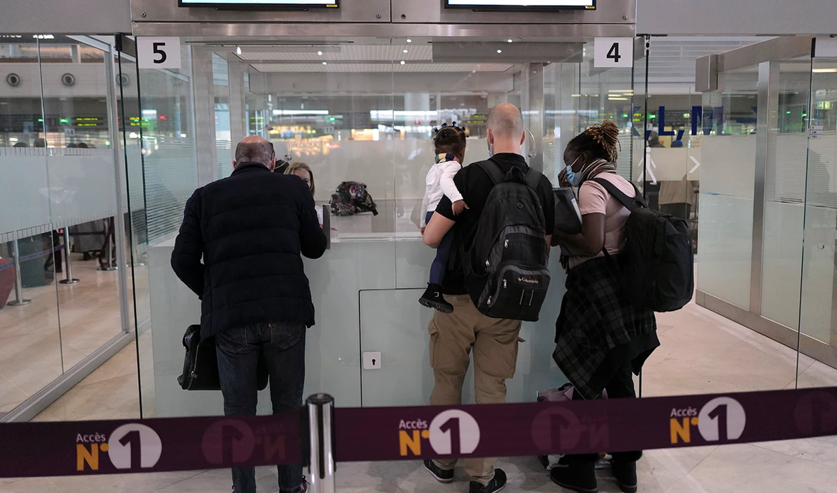 Passengers are checked by French police officers prior to boarding their plane at Paris Charles de Gaulle Airport in Roissy, north of Paris. (AP/File)