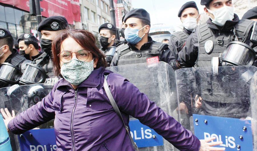 A protester scuffles with riot police during a demonstration in Istanbul organized by healthcare workers for better working conditions. (File/Reuters)