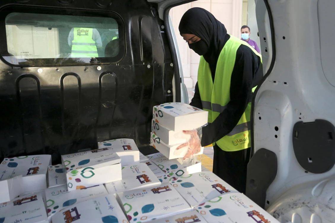 Iftar meals provided by a charity organization are distributed in Riyadh. Gulf states are tapping bond markets to help fund spending amid the pandemic. (Reuters)