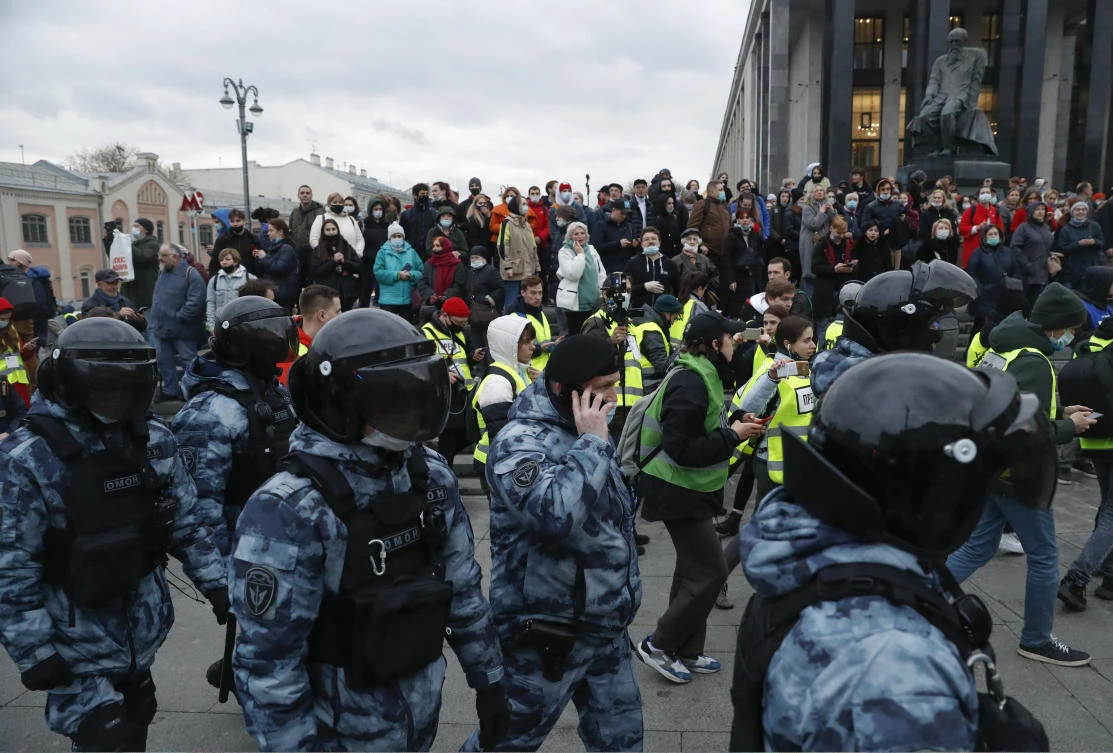 Police officers surround protesters during the opposition rally in support of jailed opposition leader Alexei Navalny in Moscow. (AP)