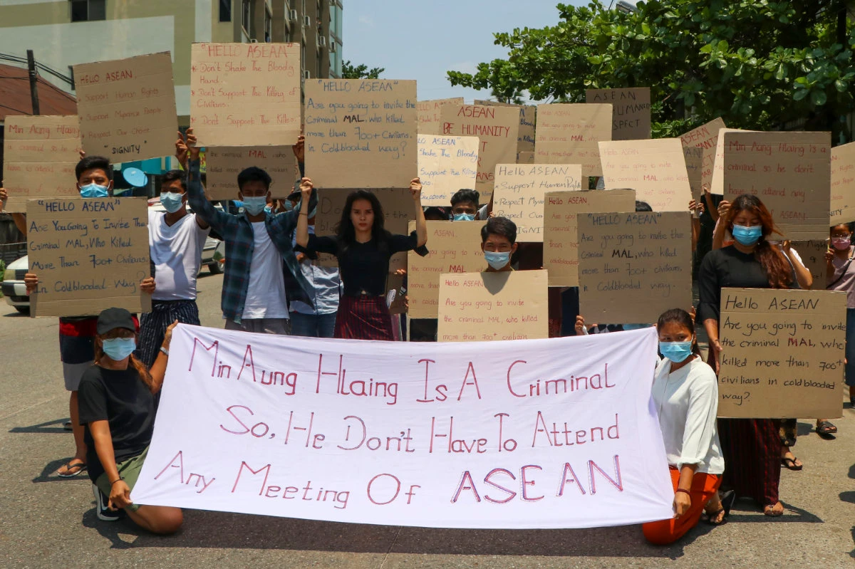 Anti-coup protesters display banners calling the attention of an ASEAN regional meeting during a rally on Tuesday April 20, 2021 in Yangon, Myanmar. (AP Photo)