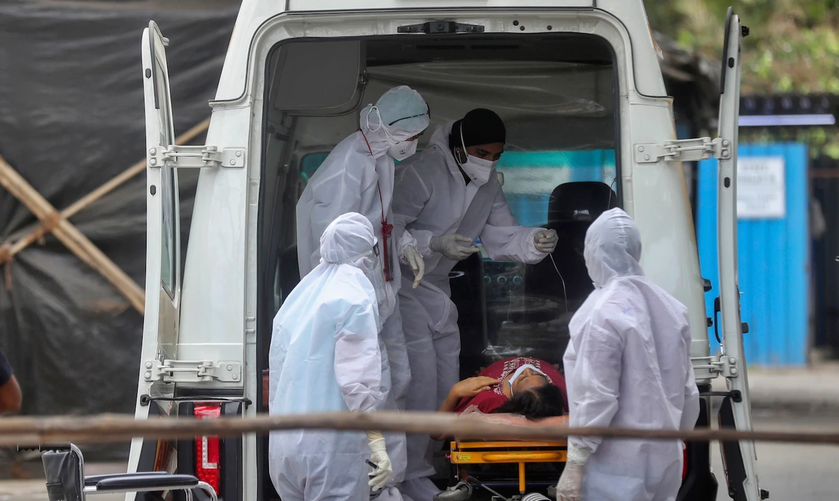 Health workers attend to a patient at the Jumbo COVID-19 filed hospital in Mumbai, India, Thursday, April 22, 2021. (AP)