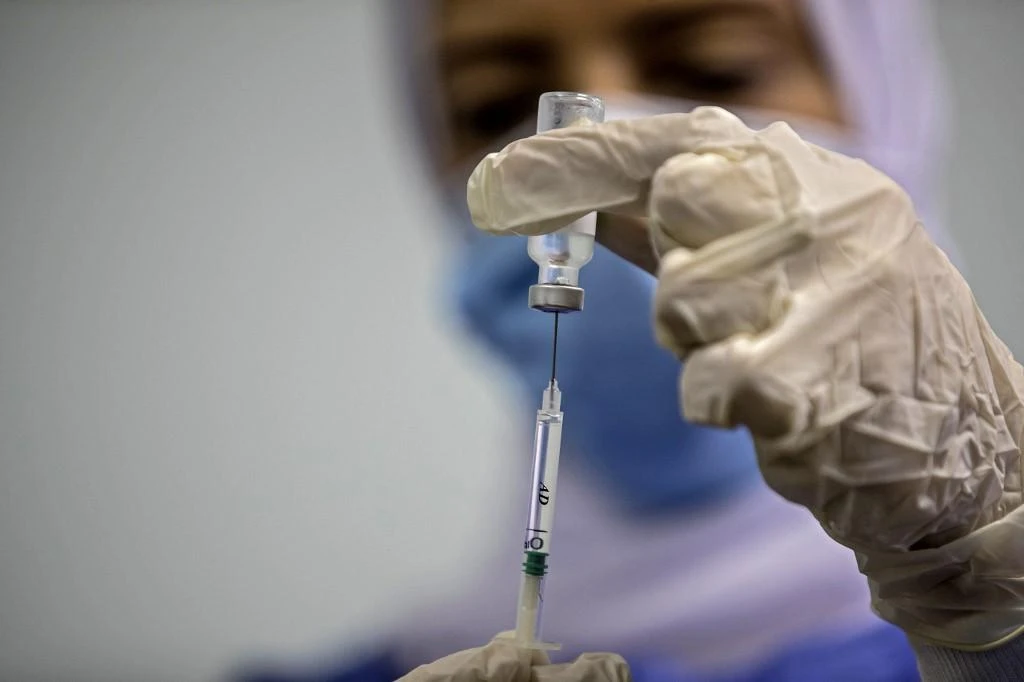 Two agreements have been signed between Vacsera and Chinese company Sinovac Biotech to manufacture the coronavirus vaccine in Egypt. (File/AFP)