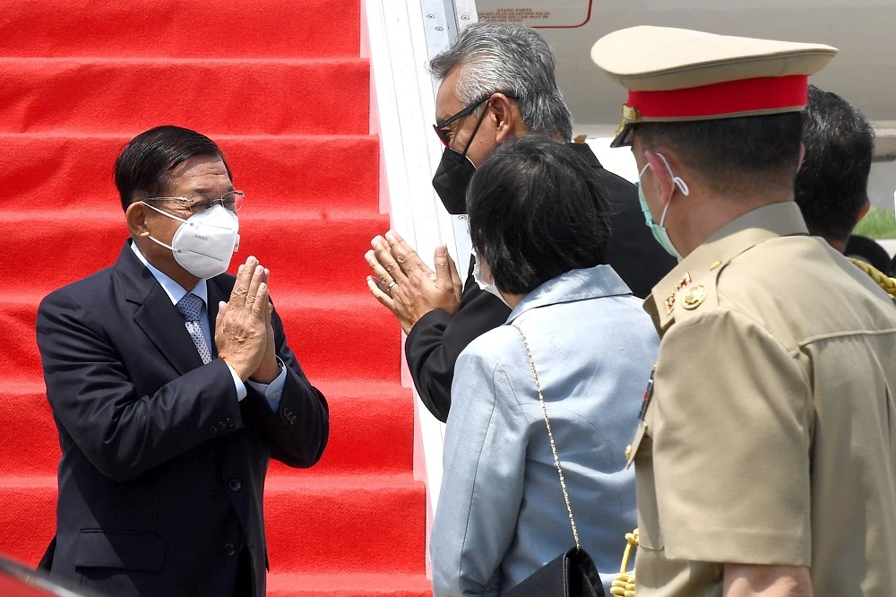 Myanmar junta leader Min Aung Hlaing, left, is greeted during his arrival at Jakarta’s Soekarno-Hatta international airport in Tangerang on April 24, 2021. (Indonesian Presidential Palace/AFP)