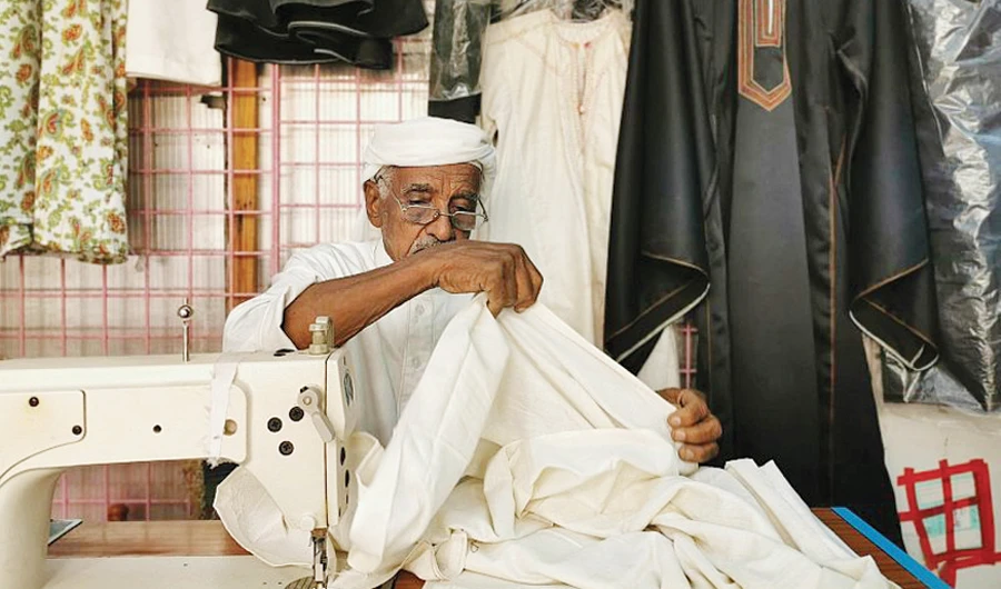 Ibn Sarwan moved on to the hand sewing machine and then the electric sewing machine, which he is currently uses in his well-known shop in the Abba Al-Saud neighborhood. (SPA)