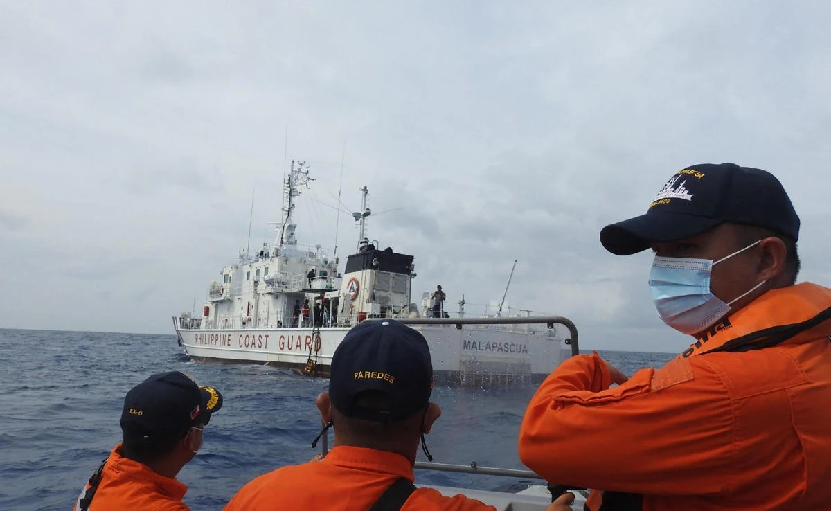 Philippine coast guard personnel conduct maritime exercises near Thitu island, in the disputed South China sea. (Philippine Coast Guard/AFP)