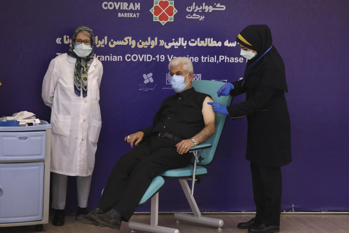 Chairman of parliament's health committee Dr. Hosseinali Shahriari, receives Covid-19 vaccine at Eram Grand Hotel in Iran that announced on Monday death toll passed 70,000. (AP)