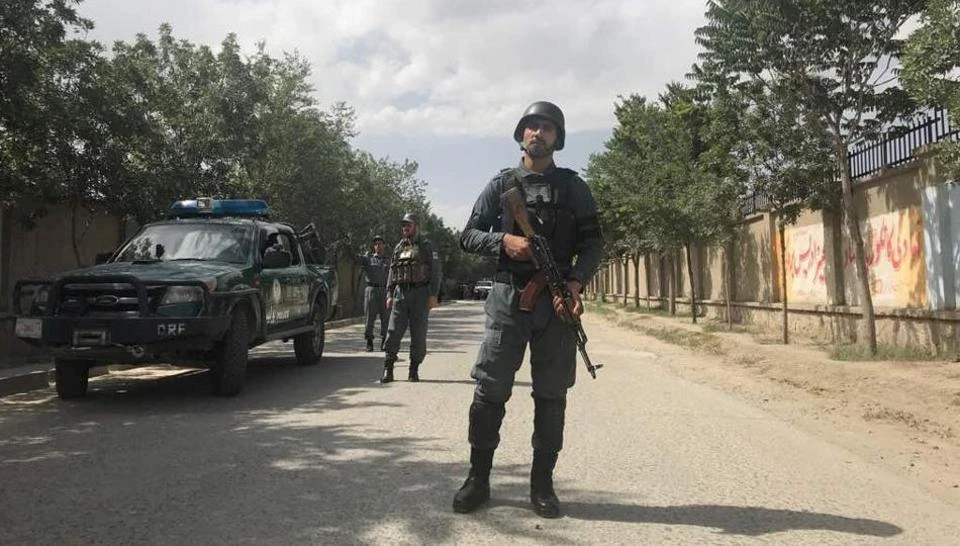 An Afghan policeman keeps watch near the site of a suicide attack in Kabul, Afghanistan June 11, 2018.(REUTERS)