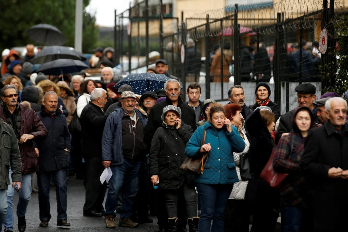 People wait in line to submit their petitions opposing a massive canal project in Istanbul, Turkey, Dec, 27, 2019. (Reuters)