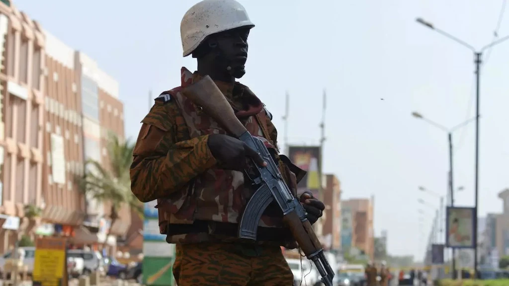 A Burkina Faso gendarme stands guard outside the Splendid hotel following an extremist attack in Ouagadougou, Burkina Faso, on January 16, 2016. (AFP)