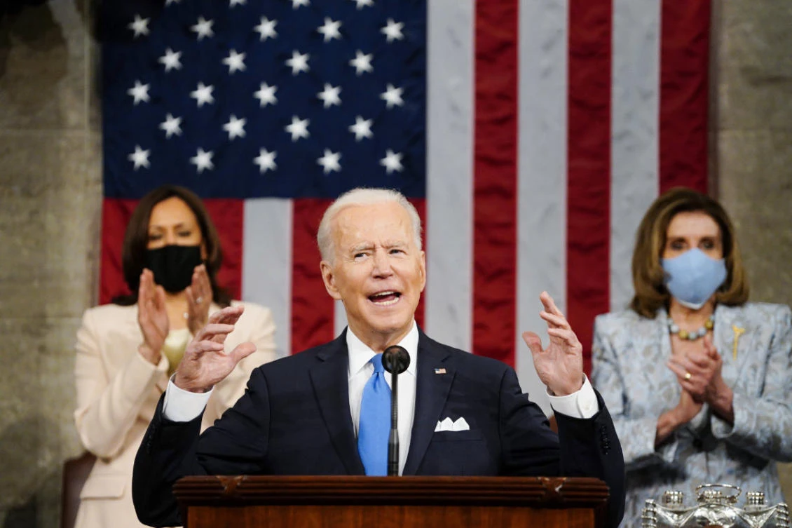 Vice President Kamala Harris and House Speaker Nancy Pelosi stand and applaud as President Joe Biden addresses a joint session of Congress on April 28, 2021, at the US Capitol in Washington. (Melina Mara/The Washington Post via AP, Pool)