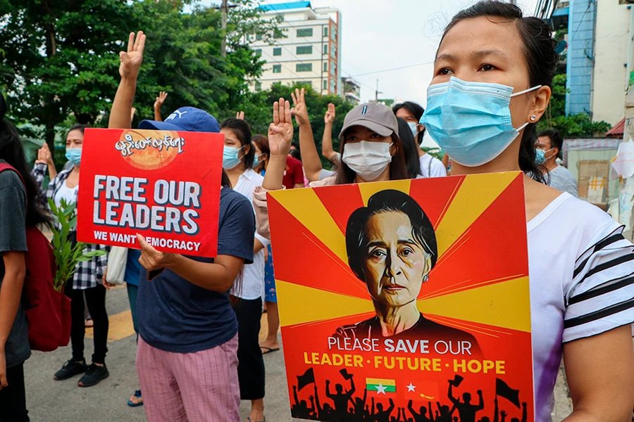 Anti-coup protesters march along a street in Yangon, Myanmar on April 24, 2021. (AP)