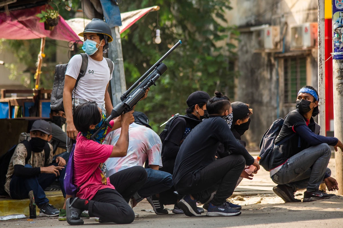 Anti-coup protesters aim to defend themselves with homemade air rifles during a demonstration against the military coup in Yangon, Myanmar, Saturday, April 3, 2021. (AP)