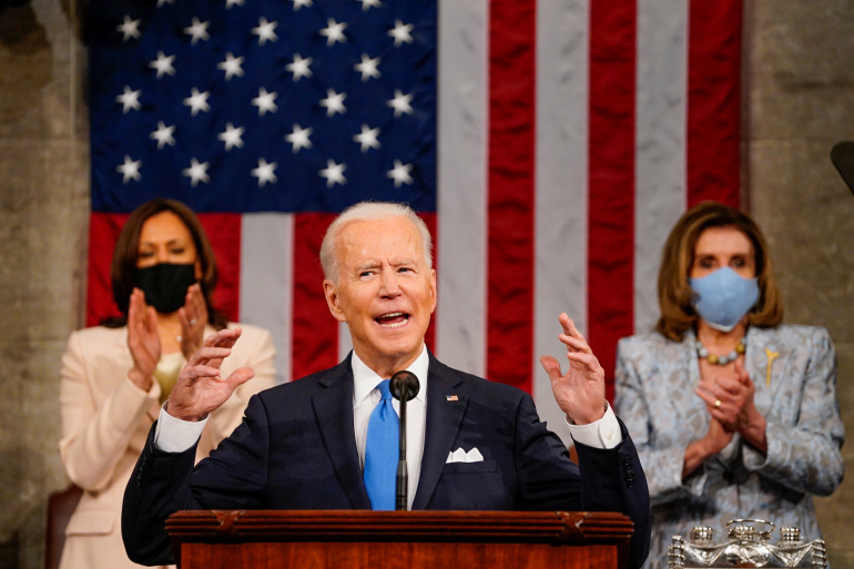 Joe Biden addresses a joint session of Congress, with VP Kamala Harris and House Speaker Nancy Pelosi in the background, Washington, April 28, 2021. (Reuters)