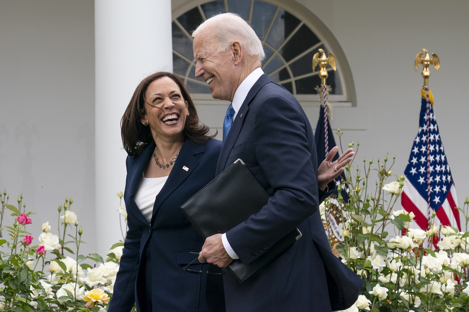 Vice President Kamala Harris and President Joe Biden walk off after speaking about updated guidance on mask mandates. (File/AP)