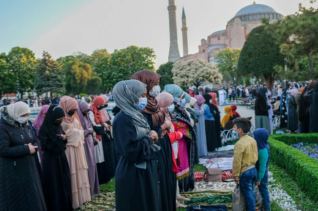 Muslims attend Eid Al-Fitr prayer outside the Hagia Sophia Grand Mosque in Istanbul, on May 13, 2021. (AFP)