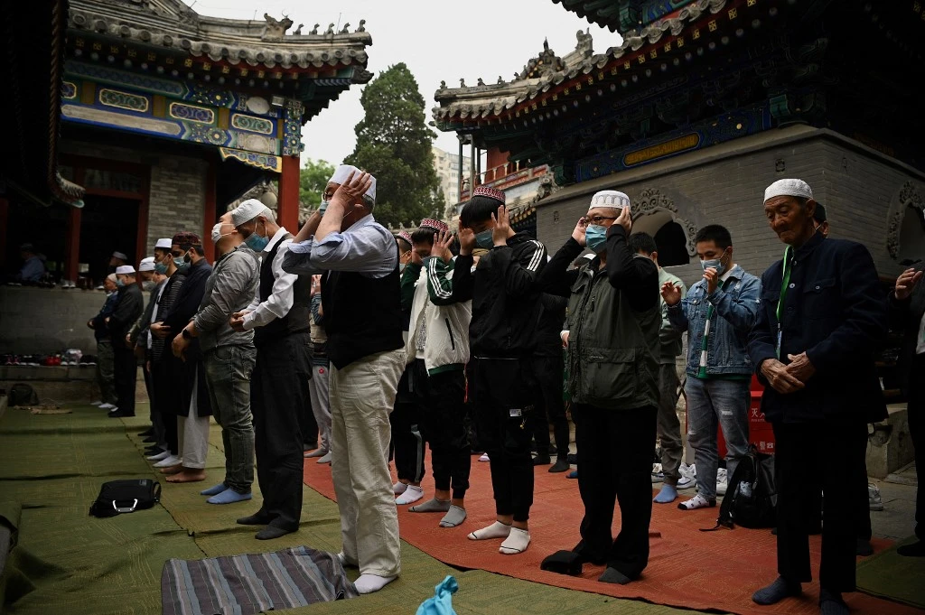 Chinese Muslims participate in Eid al-Fitr prayer at the Niujie Mosque in Beijing on May 13, 2021. (AFP)