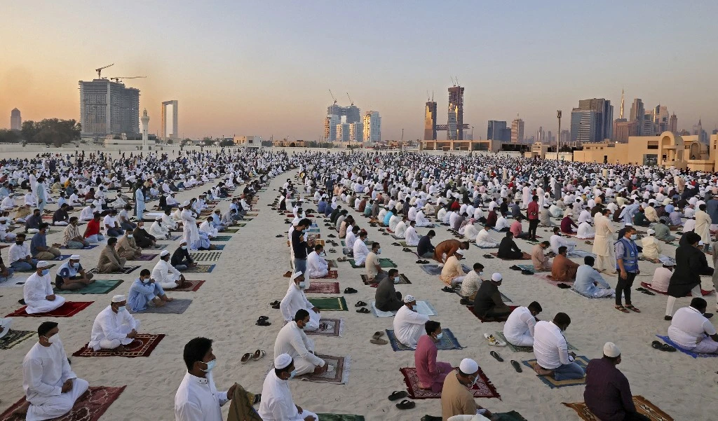 Muslims perform the Eid Al-Fitr morning prayer at Dubai’s Eid Musalla in the old port area on May 13, 2021. (AFP)