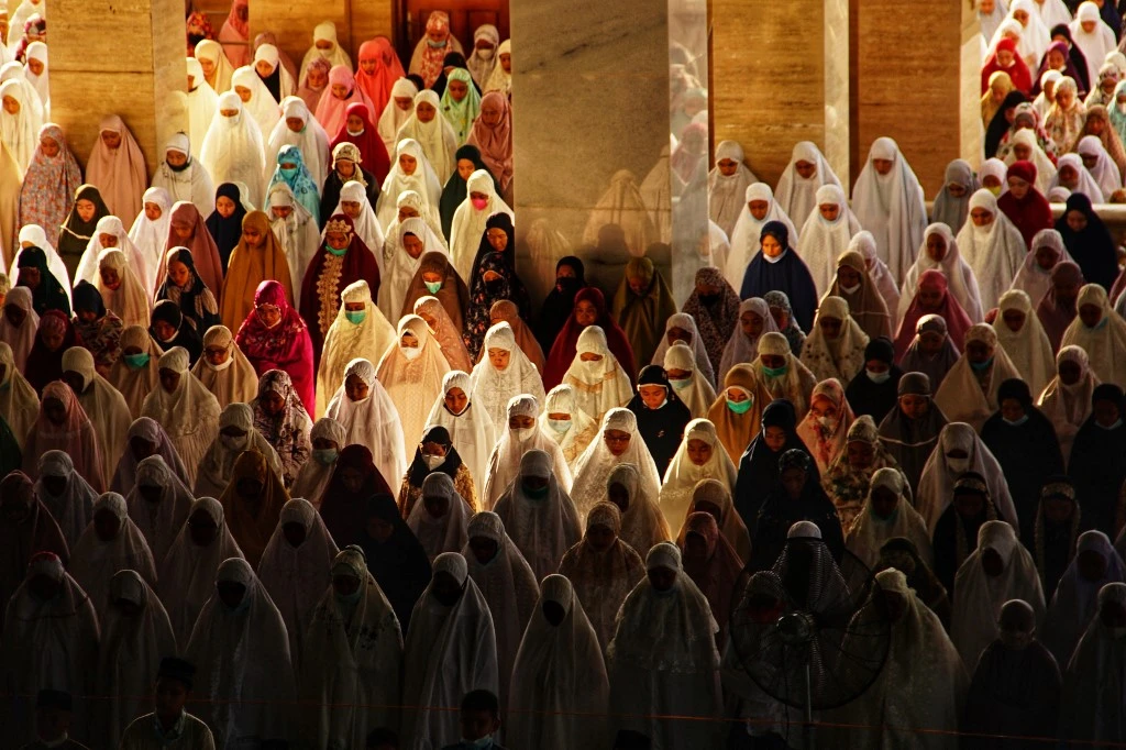 Muslims attend Eid Al-Fitr prayer at the Islamic Center in Lhokseumawe on May 13, 2021. (AFP)