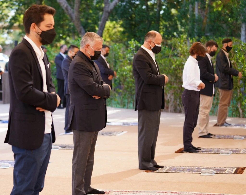 King Abdullah II (2nd L) and his son, Crown Prince Hussein (L), and half-brother Prince Faisal 3rd (C) performing the Eid Al-Fitr prayer at a mosque in the Red Sea resort of Aqabah on May 13, 2021. (AFP)