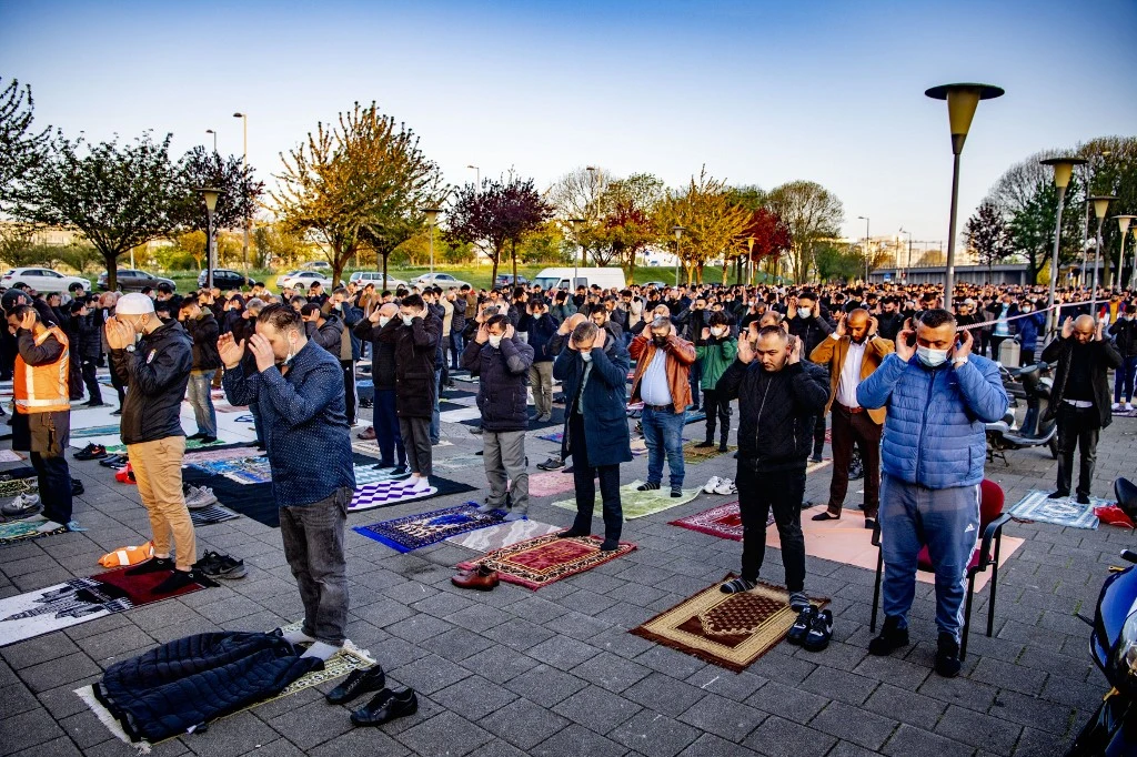 Muslims attend Eid Al-Fitr prayer at the Mevlana Mosque in Rotterdam, on May 13, 2021. (AFP)